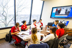 IUSB students gather together at a table.